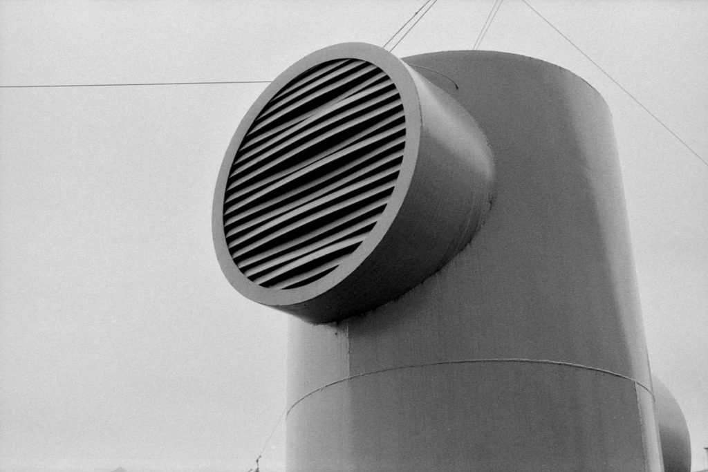 a black and white photo of a large metal object